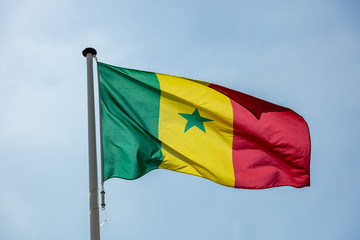 Senegal flag waving against clear blue sky