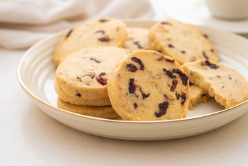 Christmas round cookies with walnuts and dried cranberries. Selective focus. Copy space.