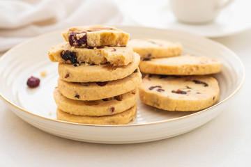 Christmas round cookies with walnuts and dried cranberries. Selective focus. Copy space.