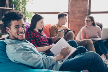 Nice attractive cheerful cheery stylish guys on bag chair preparing financial marketing data...