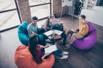 Above high angle view of nice smart clever cheery interns preparing new financial education report...