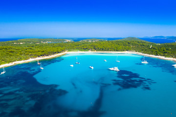Aerial view of sailing boats in a beautiful azure turquoise lagoon on Sakarun beach on Dugi Otok...