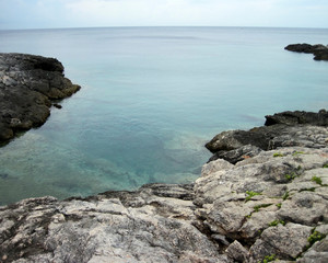 Reef and clouds on the edge of the water at island named San Domino. Tremiti.