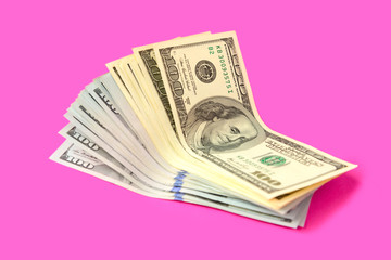 American dollars on a pink background. Business and Finance