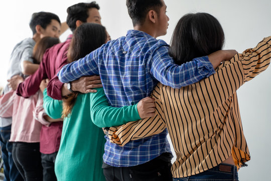 best friend holding hand shoot from behind. solid team together concept