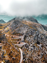 Amazing curved mountain roads on a bright summer vacation day. Exploring the mountains. National...