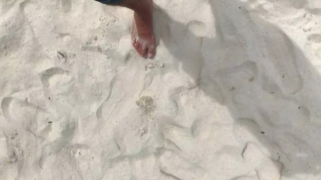 Walking on a wite sand beach