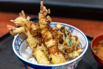 Fried shrimp with rice on bowls