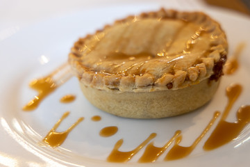 Apple pie on the white plate
