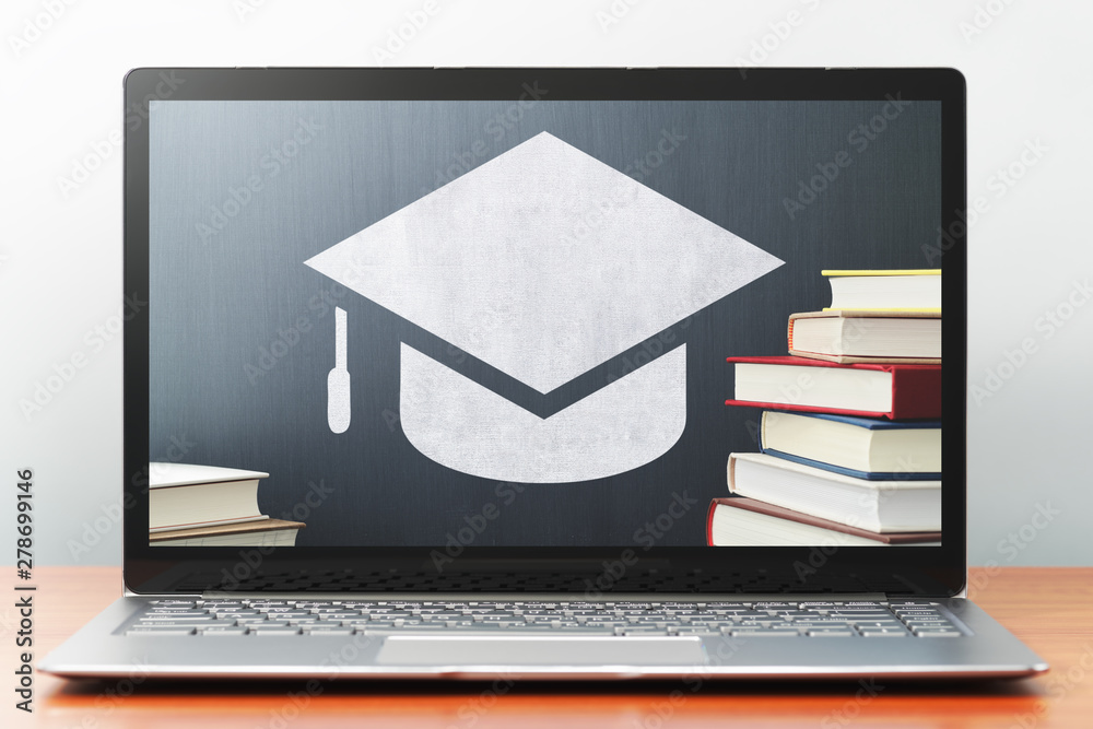Poster e-learning concept image. laptop computer on wooden desk. book, bachelor's cap icon and blackboard. 