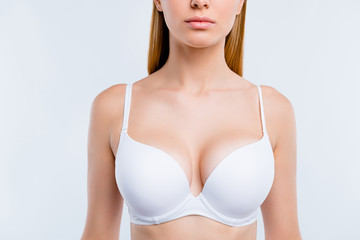 Healthy lifestyle concept. Cropped close-up portrait of nice calm lovely attractive adorable blonde girl chest wearing bra isolated over light gray background - obrazy, fototapety, plakaty