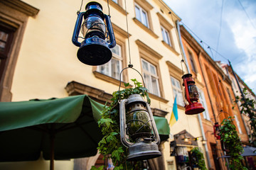 gas lamp hanging in cafe in Lviv