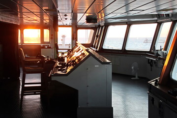 View of the sunset from the ship"s construction and navigational bridge. © masterskuz55