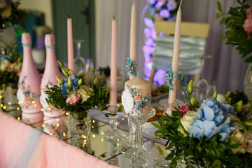 Wedding. Banquet. Table served with cutlery, flowers and crockery and covered with a tablecloth. Wedding decoration