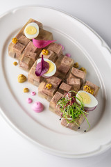 Broth jelly with meat and vegetables. Banquet festive dishes. Gourmet restaurant menu. White background.