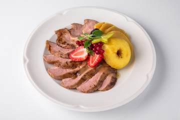 Slicing gourmet meat, pastrami, podcherevka, bastrum, beef and pork. Banquet festive dishes. Gourmet restaurant menu. White background.