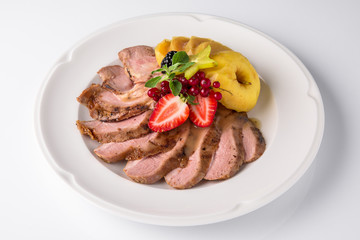 Slicing gourmet meat, pastrami, podcherevka, bastrum, beef and pork. Banquet festive dishes. Gourmet restaurant menu. White background.