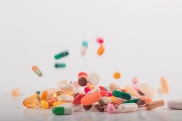 Pharmacy background on white background. Levitation pills. Tablets on white background which falling down. Pills. Medicine and healthy. Close up of capsules. Differend kind of pills  