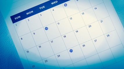 Blurred calendar on blue tone.