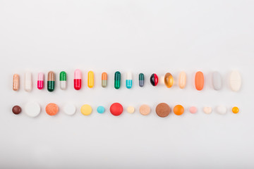 High number of pills on white background surface. High resolution image for pharmaceutical industry.  