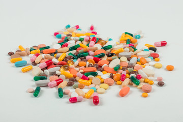 High number of pills on white background surface. High resolution image for pharmaceutical industry.  