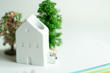 Naklejka premium Miniature people: Businessman sitting on book, reading news paper with copy space using as background business, education concept.