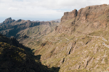 Winding mountain road leading to a small village Masca village between the mountains on Tenerife, Canary Islands, Spain