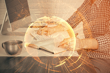 Social network theme hologram with businessman working on computer on background. Concept of world...