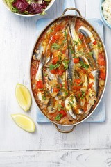 herrings baked in tomato sauce