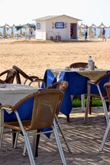 Outdoor restaurant tables near the San Pierto beach, Albania.