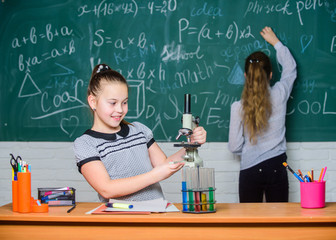 Improving modern medicine. Little girls in school lab. Science is future. Biology science. Happy little girls. science experiments. Chemistry research. Little girls scientist work with microscope