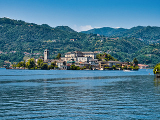 Fototapeta na wymiar Island of San Giulio in Lake Orta Italy during a summer afternoon