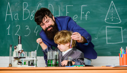 Biotech science Concept. Future dna technology. Back to school. Biology school laboratory equipment. small boy with teacher man. son and father at school. Student on exam