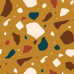 Terrazzo seamless pattern with colorful stone fragments. Decorative backdrop with mineral rock pieces scattered on orange background. Creative vector illustration for textile print, wrapping paper.