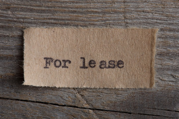 For lease typed text on a paper, real estate concept
