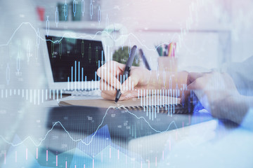 Financial graph displayed on woman's hand taking notes background. Concept of research. Double exposure