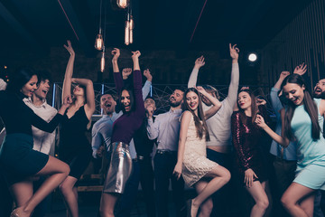 Nice-looking attractive charming glamorous fascinating cheerful positive smart elegant chic stylish ladies and gentlemen having fun time in fashionable luxury night-club indoors