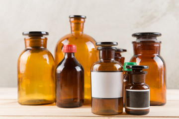 Retro pharmacy - vintage pharmacy bottles on wooden board