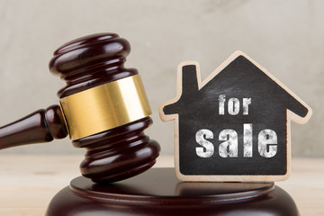 Real estate concept -auction gavel and little house with inscription For Sale