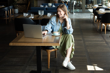 young girl drinking coffee and talking on the phone
