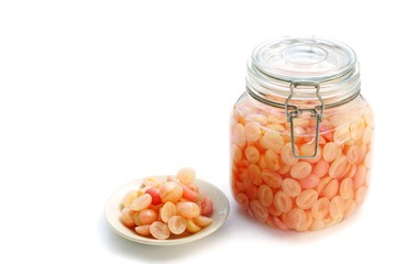 Carissa carandas or Carunda and Indian gooseberry preserved in syrup on white background. Preserved fruits for good taste.