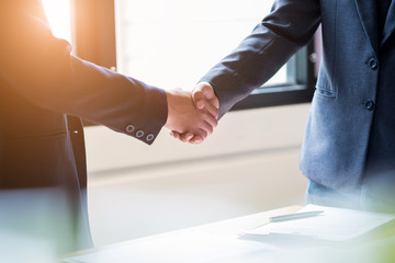 Fototapeta na wymiar Business people shaking hands in meeting room, Successful deal after meeting.
