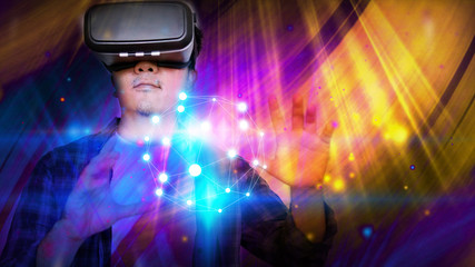 Fototapeta na wymiar Young man wearing virtual reality glasses. VR glasses