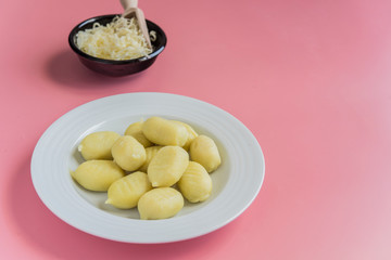 gnocchi stuffed with pesto with homemade tomato sauce and cheese