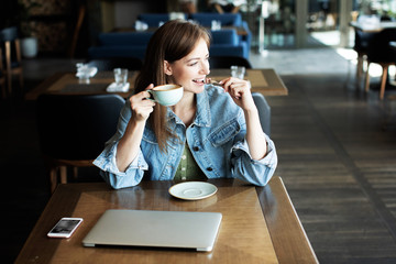 young girl drinking coffee and talking on the phone