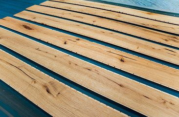 Production line of the wooden floor factory. CNC automatic woodworking machine.