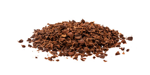 Grated chocolate. Pile of ground chocolate isolated on white background, closeup