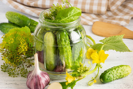 Pickled cucumbers on a light background.