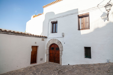 Fototapeta na wymiar Typical street in historic center, Dalt Vila of Ibiza, Eivissa, Balearic Islands. Spain.