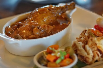 Thai tradition food : Massaman Curry is popular Thai food. Chicken curry with coconut milk, chili, and spicy herbs. Served with steamed rice. Selective focus. Still life shoot in stud